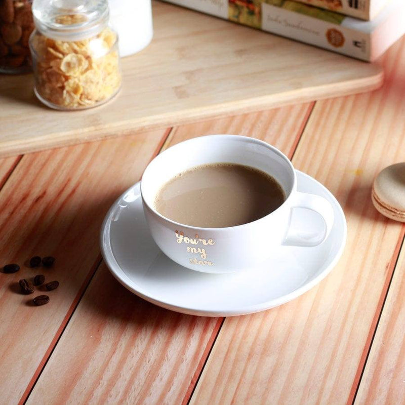 https://www.modernquests.com/cdn/shop/files/philosophy-home-porcelain-coffee-cup-and-saucer-set-my-star-2_800x.jpg?v=1690041939