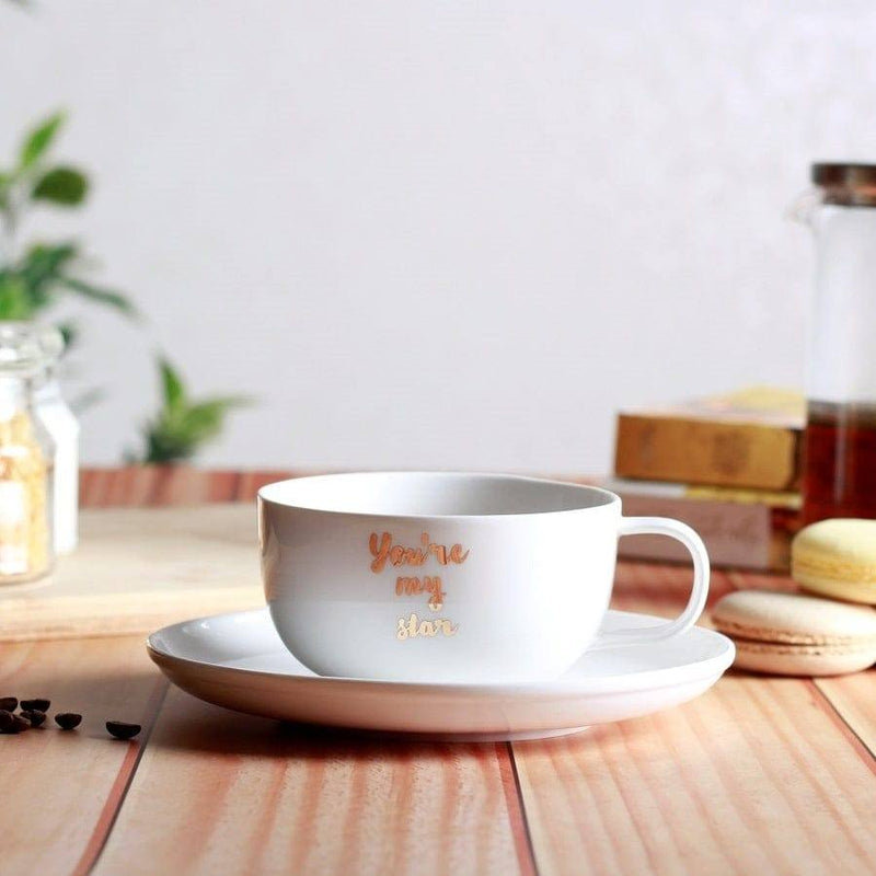 https://www.modernquests.com/cdn/shop/files/philosophy-home-porcelain-coffee-cup-and-saucer-set-my-star-4_800x.jpg?v=1690041944