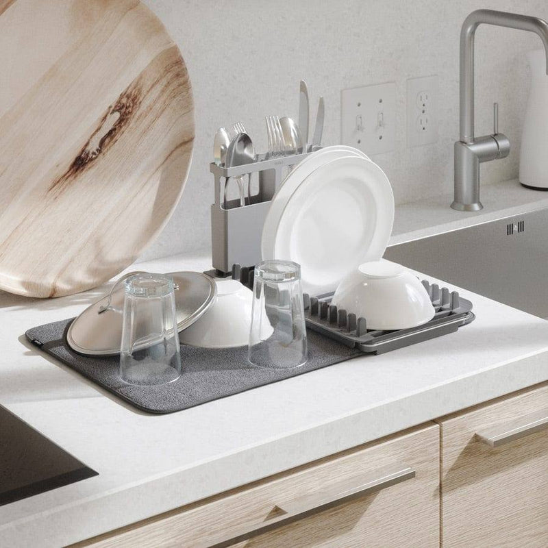 https://www.modernquests.com/cdn/shop/files/umbra-udry-over-the-sink-dish-rack-with-dry-mat-charcoal-3_800x.jpg?v=1690058484